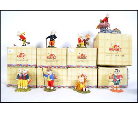 A collection of nine boxed Royal Doulton ceramic figures from the ' Rupert Collection ' to include ' Podgy Lands With A Bump 