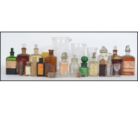 A collection of medical and chemistry lab ephemera.  To include Mersons synthetic silkworm gut stitching thread; glass beaker