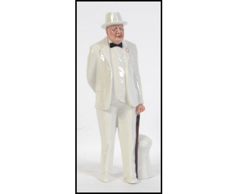 A Royal Doulton figurine of Sir Winston Churchill in white suit and black bow tie, modelled by Adrian Hughes HN 3057. Measure