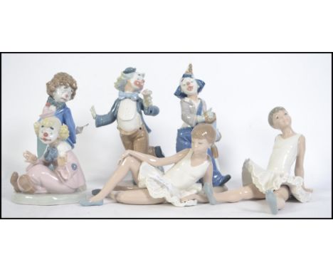 A group of Lladro Nao ceramic figures to include four clown figures together with a pair of ballet / dancing figures. All sta