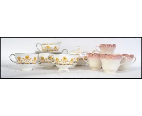 A vintage 20th century transfer printed with hand painted finish Wedgwood part tea service with yellow and black decoration t