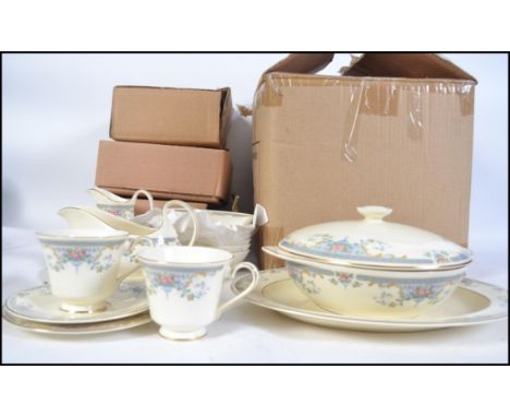 A Royal Doulton ' Juliet ' pattern extensive dinner and tea service from the Romance Collection. To include cups, saucers, pl