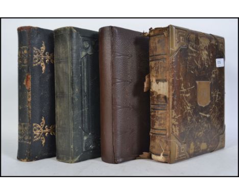 A collection of 19th - early 20th century leather and tooled photograph albums to include black and white portrait photograph