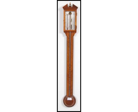A 20th century inlaid mahogany pediment stick barometer by Comitti Holborn pediment above thermostat and central mercury chan