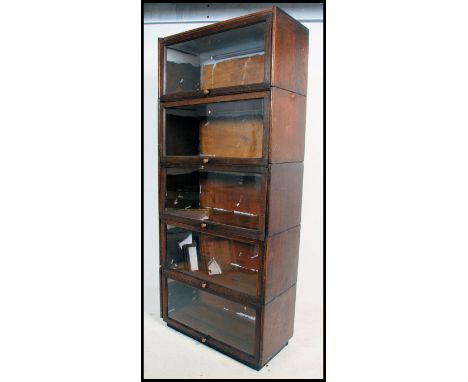 An early 20th century Globe Wernicke style oak stacking lawyers bookcase. 5 large sections having glass doors etc. Measures: 