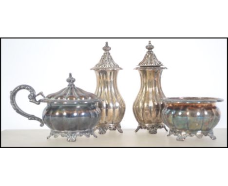 A early 20th century matching 4 piece silver condiments set by Henry Birks and Sons Canadian silversmiths comprising of two c