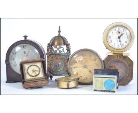 A collection of clocks to include cylinder bulkhead clock, bakelite mantel clock, lantern brass clock, Baby Ben clock by West