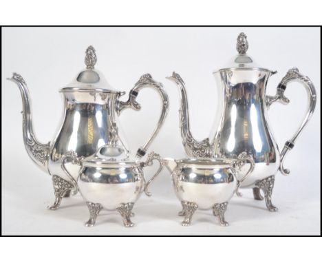 An Edwardian silver plated continental four  tea service consisting of teapot, water pot creamer and lidded sugar bowl. 28cms