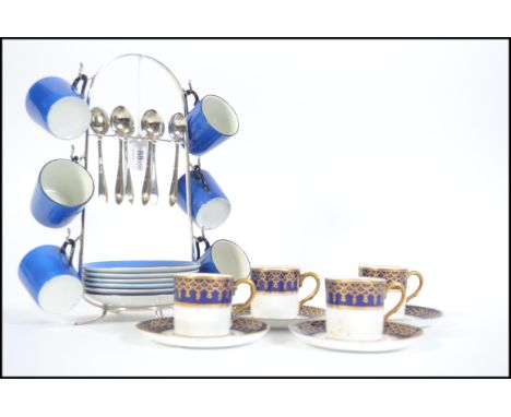 A vintage 20th century set of coffee cans on a silver plated stand with six matching tea spoons by George Bowen and Sons toge