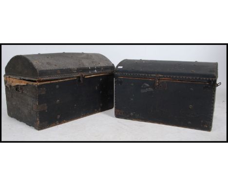 2 Victorian wooden and leather dome top travel trunk chests. Both with lined interiors with carry handles to the sides ( one 