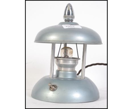 A 1930's Art Deco night light having enamel painted frame with chrome swivel finial controlling retractable light cover. Meas