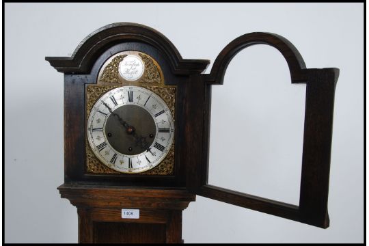 A 19 S Style Oak Tempus Fugit Grandmother Clock Having Arch Top Hood With Brass And Alloy Ro