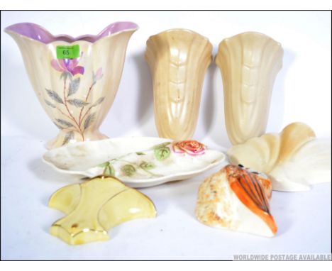 A collection of 20th century Art Deco ceramic wall pockets of German and English origin of various designs and shapes. Measur