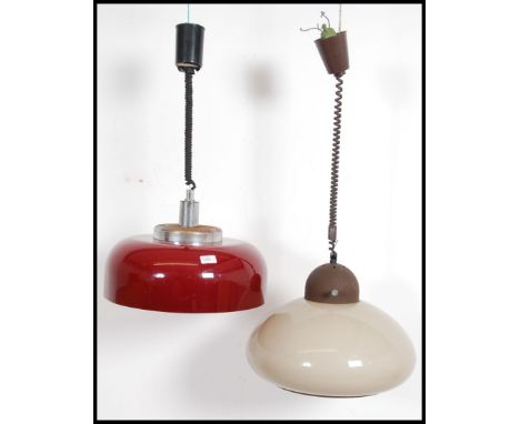 A stunning retro 20th century rise and fall mushroom ' Brevattato ' Rolly ceiling light together with another Brevattato rise