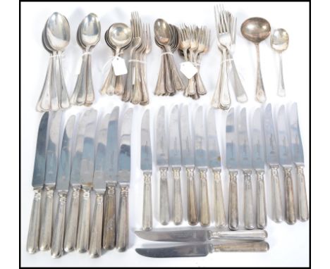 An extensive silver flatware cutlery service by John Round and Sons 1929 / 1930s to include 8 soup spoons, 5 serving spoons, 