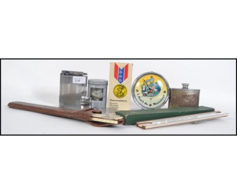 A collection of items to include a French over sized table petrol lighter, a lighter combo cigarette case, hip flask, a retro