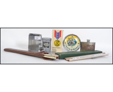 A collection of items to include a French over sized table petrol lighter, a lighter combo cigarette case, hip flask, a retro