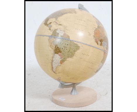 A retro 20th century Italian made Zoffoli Geographica  globe, supported by a brass swivel mount and over a circular base. Mea