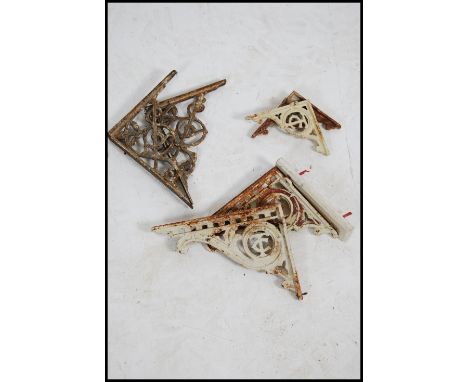 2 pairs of cast iron Victorian painted wall brackets. All of architectural form ( see illustrations )