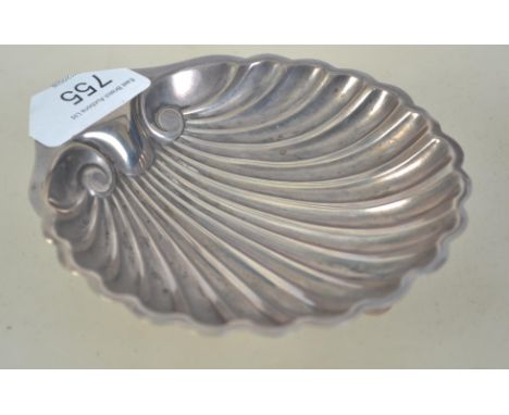 A silver hallmarked bon bon dish in the form of a scallop shell raised on three ball feet. Sheffield assay marks, makers mark