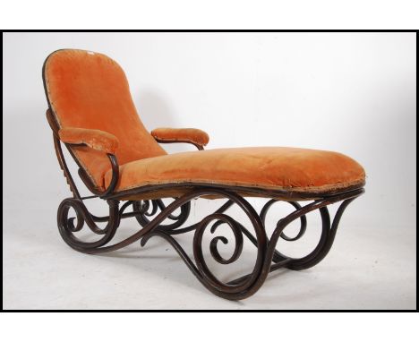 A believed Thonet 19th century bentwood chaise longue raised on stunning scrolled bentwood frame with an adjustable back rest