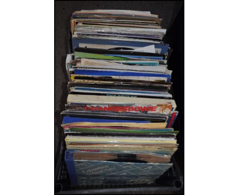 A large collection of vinyl long play LP albums dating from the 1960's through to the 1980's to include Madonna, ELO, Michael