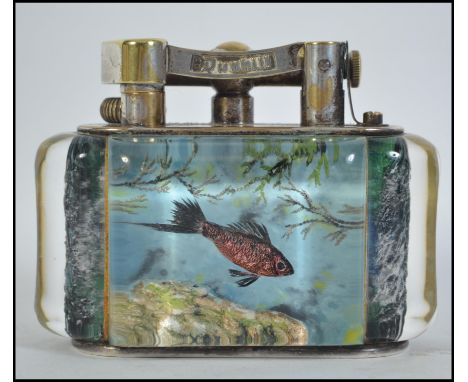 A rare Dunhill Chromium plated brass and lucite aquarium table lighter. The lighter believed to be by Ben Shillingford, circa