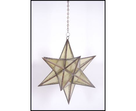 An unusual 20th century large coloured yellow glass and lead lined lantern in the form of a star ( hinged door to one panel )