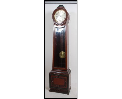 An Edwardian mahogany longcase clock with barrel / cylinder head having inset silvered dial with roman numeral chapter ring. 