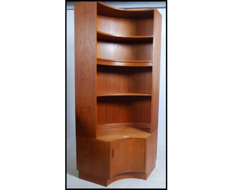 A G-Plan retro 1970's large teak wood curved corner cabinet having base and upright shelf together with a small G-Plan side c