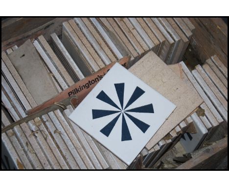 A large collection of decorative ceramic glazed tiles with geometric designs by Carter Pilkington