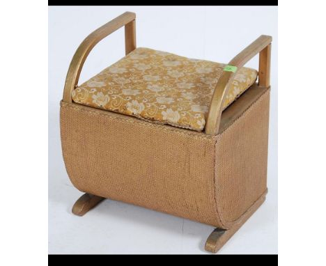 A vintage 20th century Art Deco styled Lloyd Loom laundry basket. with a bent wood show frame support and padded top. Measure