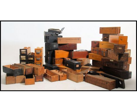 A vast collection of early 20th century Industrial glass magic lantern slide boxes and drawers along with some vintage projec