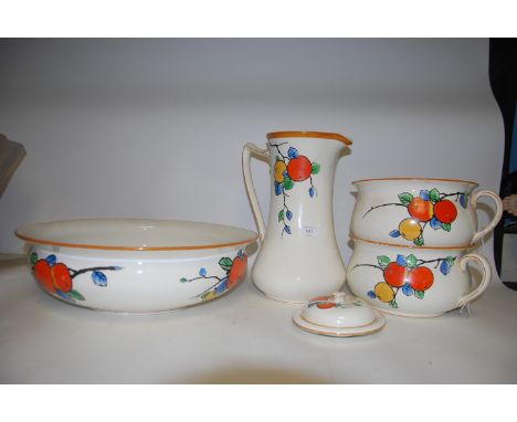 A 1930's Crown Ducal ceramic bathroom set comprising jug and bowl, chamber pot and other items all with transfer print floral