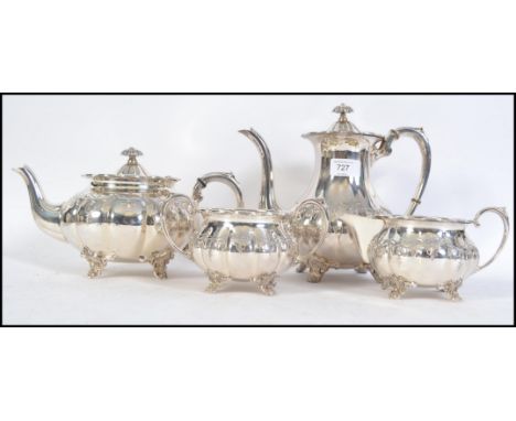 A 20th century four piece silver plated tea service by Cooper Brothers consisting of teapot, water pot, sugar bowl and creame