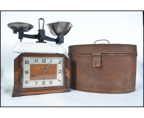 A Victorian tin hat box of oval form with hinged lid together with a 1930's Art  Deco mantel clock and a pair of Avery's vint