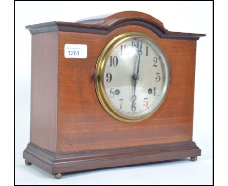 An Edwardian early 20th century satin wood inlay eight day mantel clock with makers marks to movement for Newhaven. Measures 