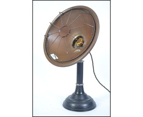 An early 20th century cast metal and copper desk lamp. The copper surround with cage being rewired. Measures 49cms high.