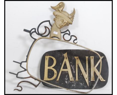 A stunning vintage early to middle 20th century advertising sign and forged mount. The sign having 3D letters with notation r
