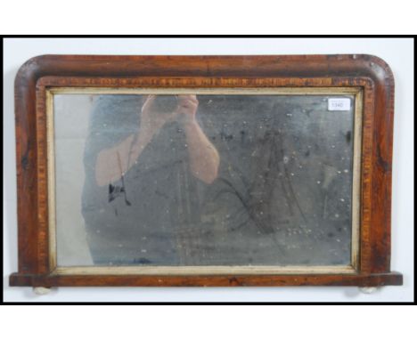 A Victorian walnut tunbridge inlaid wall mirror - overmantel mirror having ceramic bun feet. Measures: 71cms high x 42cms wid