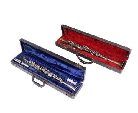 An American 'Legionnaire' silver plated clarinet, original case; and another 'Rene Duval' metal clarinet, cased. (2)