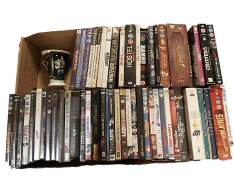 A collection of DVDs, mostly music related, featuring artists: The Doors, Bob Marley, Pink Floyd, Oasis, Saxon, Live Aid, The