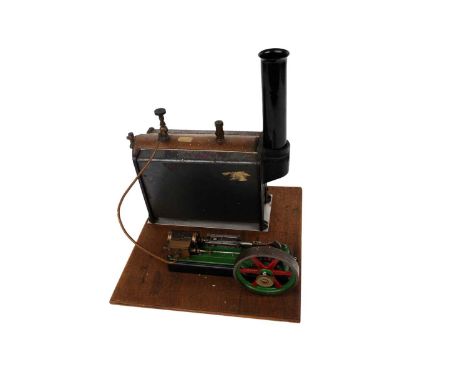 A Stuart Turner stationary steam plant, comprising of a Babcock no.501 Stuart Turner boiler, powering a fly wheel piston engi