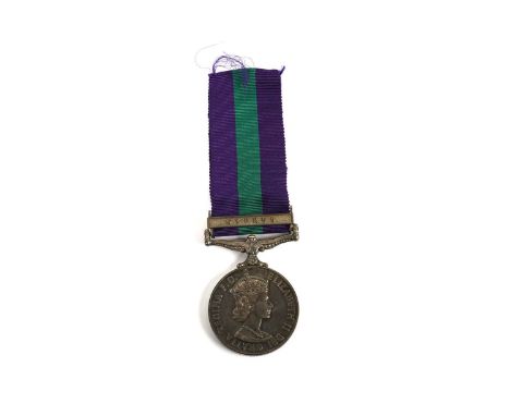 A 20th Century Elizabeth II General Service medal, with Cyprus clasp, awarded to 'Lt. J. B. Huskins R. A.', on a purple and g