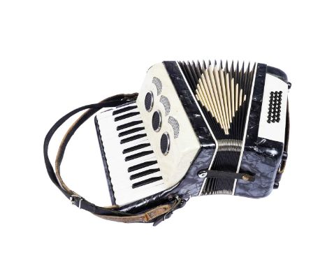A Continental Delve HIO 24 bass student accordion, in grey and cream plastic casing.