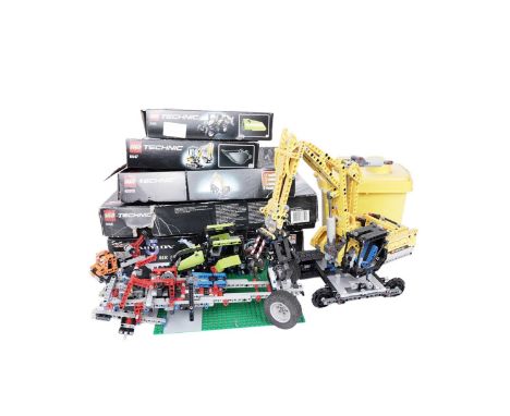 A selection of LEGO Technic vehicles, comprising: a 9393 Tractor; and a 42006 Excavator; together with LEGO Technic boxes, so