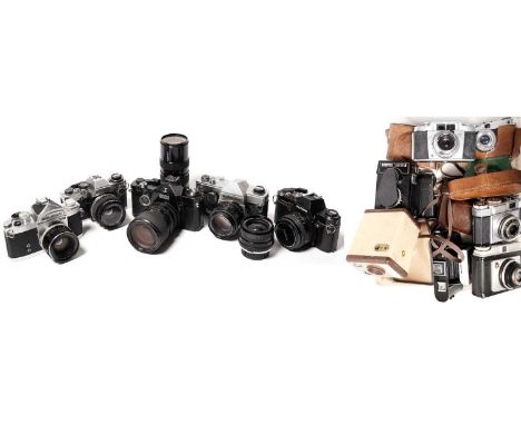Various SLR cameras by Konica and others, comprising: a Konica Autoreflex TC camera and lens; an Olympus OM10 camera; and thr