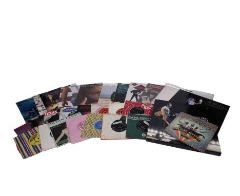 Mixed 12" and 7" Rock records, featuring artists: Bruce Springsteen, Prince, The Rolling Stones, The Beatles, Queen, Stevie N