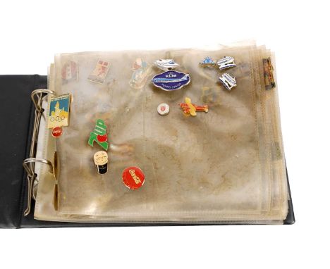 A collection of vintage enamel button pins/badges, including: London 1948 Olympics; Guinness; travel interests; cartoons; and
