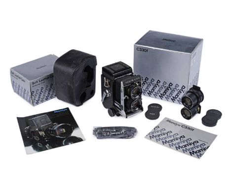 A Mamiya C330f Twin Reflex camera, with 80mm f 2.8 lens, with instruction manual and box; together with a spare 135mm f 4.5 l